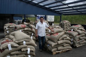 A proud Javier Cisneros and coffees ready to ship